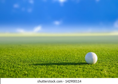 Golf Ball On Green Grass With Blur Background