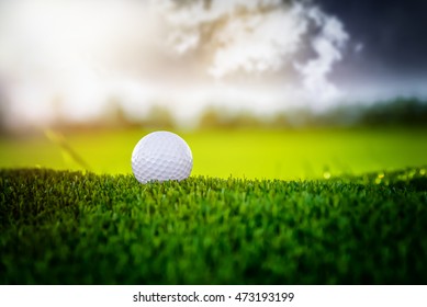 Golf Ball On Sunset Cloud Sky Background