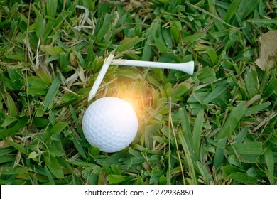 Golf Ball On Tee In Beautiful Golf Course At Broken Tee Background. Golf Ball On Green Grass  In Golf Course At Thailand