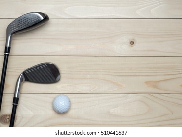Golf and ball on wood table . top view, flat lay composition 