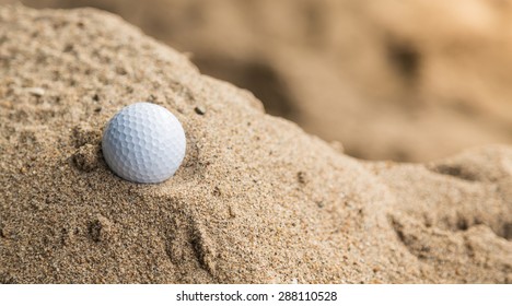 Golf Ball In Sand Bunker