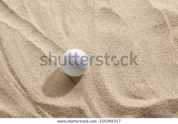 Golf ball in sand\
trap