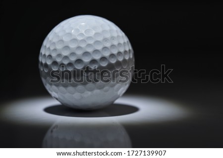 golf ball shape texture light and shadow on dark gray background.