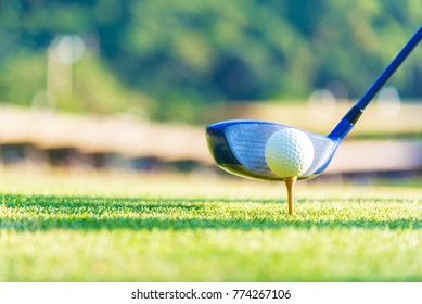 Golf ball and tee on green grass background.Golfers hit sweeping and keep golf course in the summer for relax time