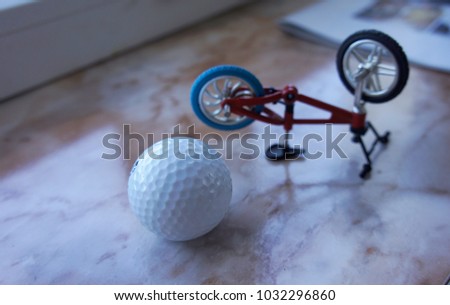 golf ball and toy bike decor