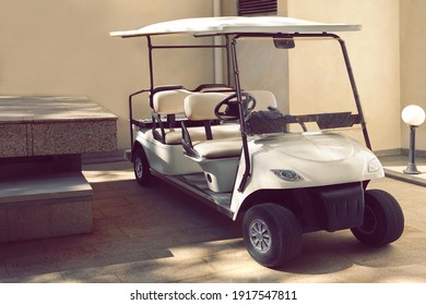 Golf Car. Electrical Hotel Or Resort Service Car Closeup. Long Electric Shuttle Passenger Bus.