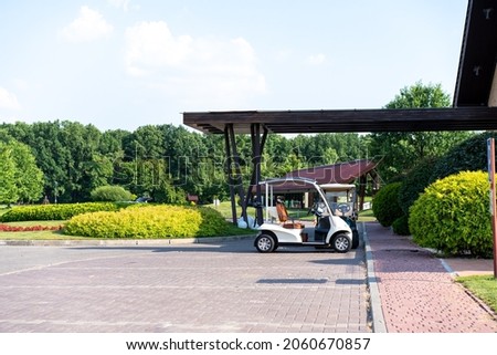 Golf car standing parking golf club Warm summer day Luxury lifestyle concept