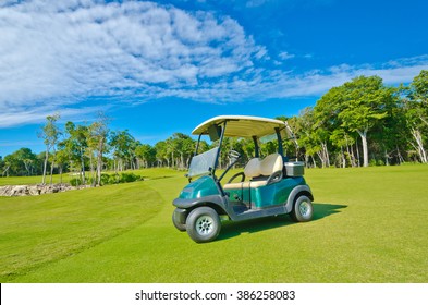 Golf cart at the beautiful caribbean, tropical golf course.