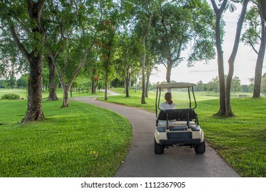 Golf cart or car on golf course. Looking see beautiful layout and fairway.