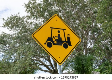 Golf Cart Crossing Sign In Tropical Florida