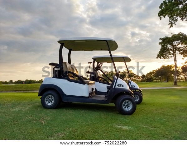 golf cart on the lawn in\
golf course