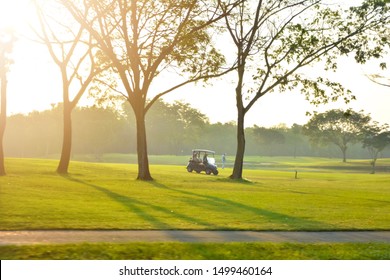 Golf Cart Park In Front Of Green Golf Court, Landscape.