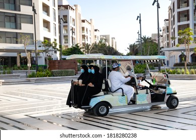 Golf Cart Taking A Family Around The Marina. Al Mouj, The Wave, Muscat, Oman. September 7, 2020.