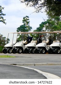 Golf Carts Lined Up And Ready To Be Used