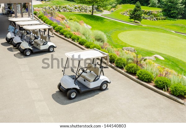 Golf carts on a golf\
course