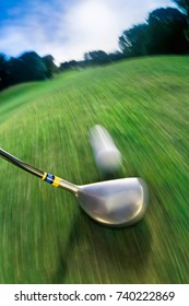 Golf Club Hitting Ball On Golf Course