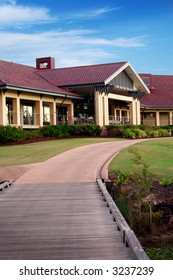 Golf Clubhouse - 19th Hole Against A Blue Sky