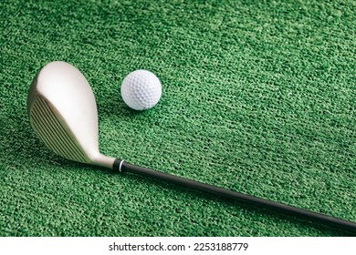 Golf clubs and balls on an astroturf - artificial grass background. - Shutterstock ID 2253188779