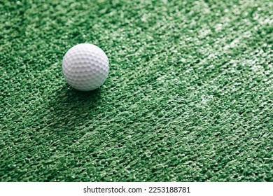 Golf clubs and balls on an astroturf - artificial grass background. - Shutterstock ID 2253188781