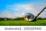 Golf clubs and balls on a green lawn in a beautiful golf course with morning sunshine. Close up of golf equipment on green grass.                                 