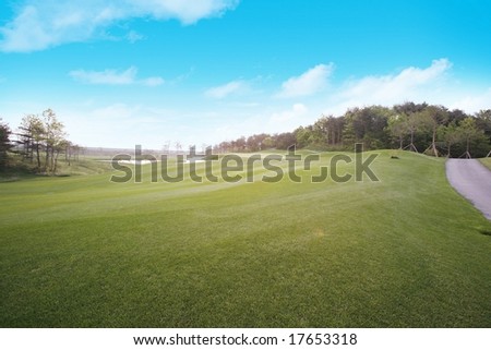 Similar – A tranquil aerial view of a lush golf course fairway, bathed in the warm glow of sunset. Ideal for themes of relaxation, nature, and sports, this image captures the peaceful beauty of the golfing experience.