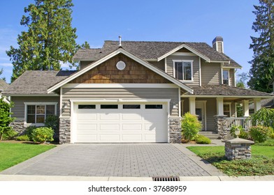 golf course resort home with blue sky & lush landscaping - Powered by Shutterstock