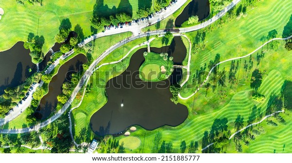 golf course\
sport Aerial top view of golf field landscape with sunrise view in\
the morning shot. Bangkok\
Thailand