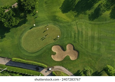 Golf course sport, green grass and trees on a golf field, fairway and putting green top view, Bangkok Thailand. bird view over Golf course in the tropical asia. - Powered by Shutterstock