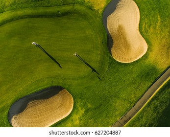 Golf Course Top View With Players. Aerial View Of Golfers On Putting Green.