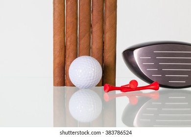 Golf Driver And Different Cigars On A Glass Table