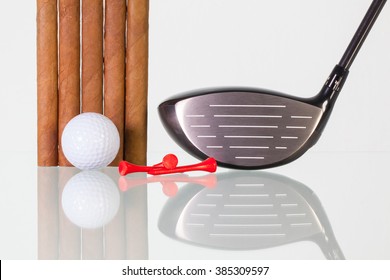 Golf Driver And Different Cigars On A Glass Table