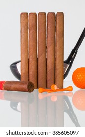 Golf Driver And Different Cigars On A Glass Table