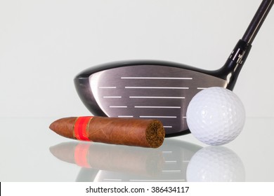 Golf Driver And Different Cigars On A Glass Table