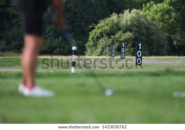golf driving\
range scene prior to a\
tournament