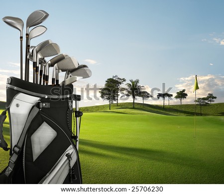 golf equipment on green and hole as background