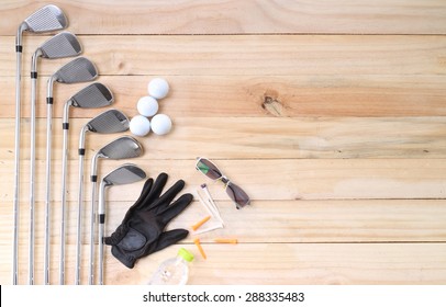 Golf Equipment On Wood Floor Preparing For Good Game 