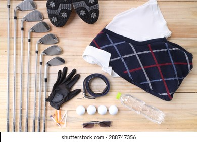 Golf Equipment On Wood Floor Preparing For Good Game 