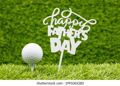 Golf Father's Day with tee and ball on green grass - Powered by Shutterstock