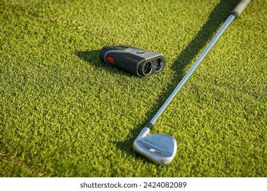 Golf , green grass, Laser Rangefinder, binoculars for golf observing, golfer stick.  - Powered by Shutterstock