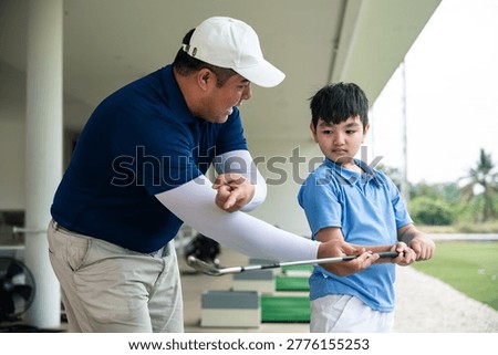 Golf lesson close up of a coach teaching proper grip technique, ideal for highlighting fundamentals and beginner golf instruction visuals.
