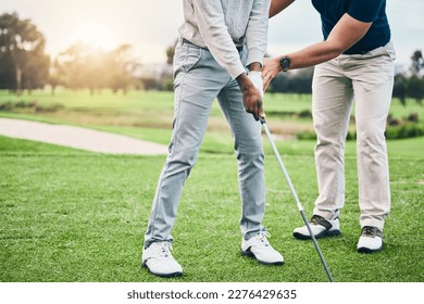 Golf lesson, sports teaching and coach hands helping a man with swing and stroke outdoor. Lens flare, green course and club support of a athlete ready for exercise, fitness and training for a game - Shutterstock ID 2276429635