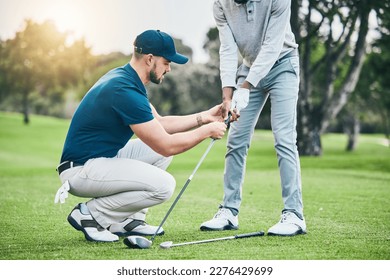 Golf lesson, teaching and sports coach help man with swing, putt and stroke outdoor. Lens flare, green course and club support of a athlete ready for exercise, fitness and training for a game - Shutterstock ID 2276429699