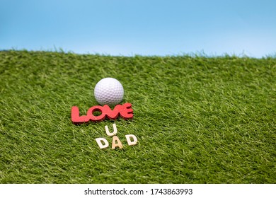 Golf love you dad with golf ball Happy Father's Day on green grass - Powered by Shutterstock