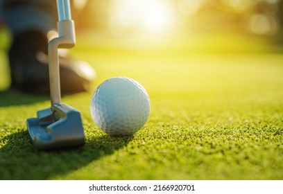 Golf Player Using Putter Club Make a Stroke with the Intention of Rolling the Ball into the Hole. Golf Tournament. 
