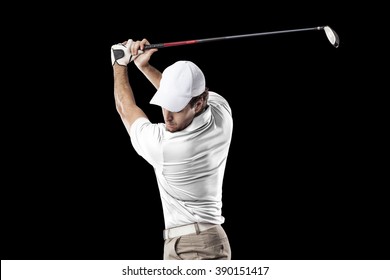 Golf Player In A White Shirt Taking A Swing, On A Black Background.