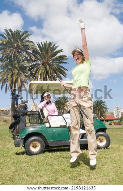 Golf players during a\
game