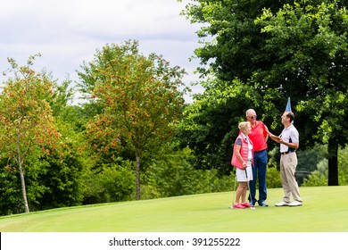 Golf pro with senior woman and man analyzing results - Powered by Shutterstock