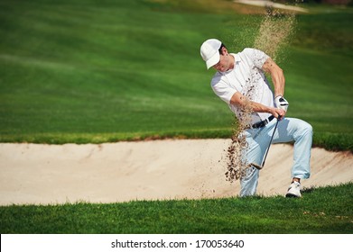 golf shot from sand bunker golfer hitting ball from hazard - Powered by Shutterstock