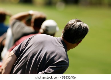 Golf Spectator Waits For The Ball