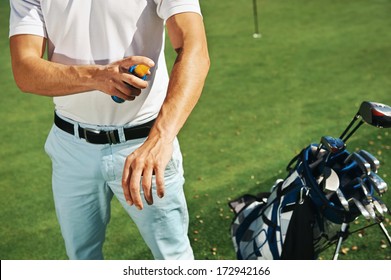 Golf Sport Man With Sunblock Lotion Spray For Spf Protection